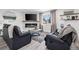 Bright living room with comfortable seating, fireplace, and stylish decor at 217 Douglas Fir Ave, Castle Rock, CO 80104