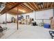 Unfinished basement with exposed beams and a projector screen at 7083 Winthrop Cir, Castle Rock, CO 80104