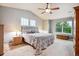 This bedroom boasts vaulted ceilings, neutral walls, and a ceiling fan for added comfort at 7083 Winthrop Cir, Castle Rock, CO 80104