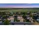 Charming street showcasing well-maintained homes with manicured lawns, mature trees, and inviting curb appeal at 7083 Winthrop Cir, Castle Rock, CO 80104