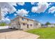 Spacious backyard featuring a lawn, patio, and a trampoline for outdoor fun at 21354 E 51St Ave, Denver, CO 80249