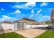 Fenced backyard features a large storage shed, concrete patio, and well-maintained grass at 21354 E 51St Ave, Denver, CO 80249