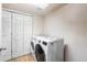 Convenient laundry room with a front-loading washer and dryer and extra closet space at 21354 E 51St Ave, Denver, CO 80249