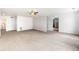 Open concept living room with abundant space, featuring a ceiling fan and bright lighting at 21354 E 51St Ave, Denver, CO 80249
