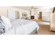 Spacious main bedroom features a cozy fireplace, ceiling fan, and an ensuite bathroom at 21354 E 51St Ave, Denver, CO 80249