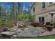 Inviting backyard with a charming pond, waterfall feature, and comfortable seating area at 20190 Deer Shadow Way, Monument, CO 80132