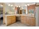 Large bathroom featuring double vanity, bathtub, tile floors, and ample counter space at 20190 Deer Shadow Way, Monument, CO 80132