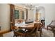 Formal dining room with a wooden table, upholstered chairs, and a chandelier at 20190 Deer Shadow Way, Monument, CO 80132
