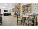 Relaxing living room featuring stone fireplace and dining area near the window at 20190 Deer Shadow Way, Monument, CO 80132