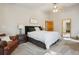 Serene bedroom with carpeted floors, ceiling fan, and ensuite access at 20190 Deer Shadow Way, Monument, CO 80132