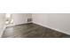 Bright bedroom with wood flooring and a window providing natural light at 955 Eudora St # 207E, Denver, CO 80220