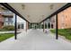 Building entrance featuring a covered walkway, secure entry, and landscaped surroundings at 955 Eudora St # 207E, Denver, CO 80220