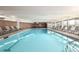 Bright and clean indoor pool with lounge chairs, perfect for year-round enjoyment at 955 Eudora St # 207E, Denver, CO 80220