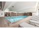 Inviting indoor pool area with lounge chairs, offering a relaxing amenity for residents at 955 Eudora St # 207E, Denver, CO 80220