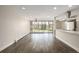 Bright, open-concept kitchen and living room area featuring a large window to let in sunlight at 955 Eudora St # 207E, Denver, CO 80220
