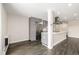 Modern kitchen featuring stainless steel appliances, grey cabinetry, hardwood floors, and a quartz-topped island at 955 Eudora St # 207E, Denver, CO 80220