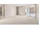 Bright living room with carpeted floors and sliding glass doors at 955 Eudora St # 207E, Denver, CO 80220