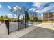Community outdoor pool area with gated access and nearby seating at 955 Eudora St # 207E, Denver, CO 80220