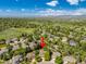 Aerial view of a property in a neighborhood with mature trees and mountain views at 10859 Irving Ct, Westminster, CO 80031