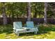 A backyard with a bench with comfortable outdoor cushions sits next to the house at 10859 Irving Ct, Westminster, CO 80031