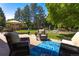 Large, well-maintained backyard featuring a paver patio with outdoor seating and lush landscaping at 10859 Irving Ct, Westminster, CO 80031