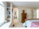Comfortable bedroom featuring a built-in window seat, storage, and an attached bathroom at 10859 Irving Ct, Westminster, CO 80031