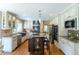 Gourmet kitchen features custom cabinets, stainless steel appliances, granite countertops, and a central island at 10859 Irving Ct, Westminster, CO 80031