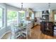 Bright kitchen with stainless appliances, stone countertops, breakfast nook and hardwood floors at 10859 Irving Ct, Westminster, CO 80031