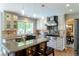 Modern kitchen featuring stainless steel appliances, custom cabinetry, granite countertops and island with seating at 10859 Irving Ct, Westminster, CO 80031