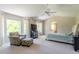 Spacious main bedroom with sitting area, ceiling fan, and lots of natural light at 10859 Irving Ct, Westminster, CO 80031