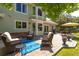 Relaxing patio with comfortable seating, dining set, and beautifully landscaped yard at 10859 Irving Ct, Westminster, CO 80031