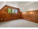 Attic bedroom with carpet, wooden paneling and mountain views at 422 Fairview Blvd, Breckenridge, CO 80424