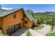Attractive exterior featuring a two-story home with a garage and scenic mountain backdrop at 422 Fairview Blvd, Breckenridge, CO 80424
