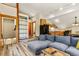 Open living room, kitchen, and staircase with hardwood floors at 422 Fairview Blvd, Breckenridge, CO 80424