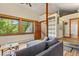 Comfortable living room with natural light and doorway access to a bathroom and staircase at 422 Fairview Blvd, Breckenridge, CO 80424