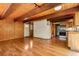 Inviting living area with hardwood floors, wooden ceilings and an adjacent kitchen for easy entertaining at 422 Fairview Blvd, Breckenridge, CO 80424