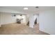 Finished basement featuring new carpet, bar area and access to stairs at 5886 Urban St, Arvada, CO 80004