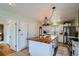 Spacious kitchen featuring a large island, stainless steel appliances, and ample counter space at 5886 Urban St, Arvada, CO 80004