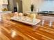 Four cupcakes are presented on a unique pedestal tray, beautifully displayed on the kitchen island at 5886 Urban St, Arvada, CO 80004