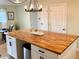 The large kitchen island is perfect for meal preparation and entertaining, showcasing the designer cupcakes at 5886 Urban St, Arvada, CO 80004
