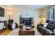 Relaxing living room with fireplace, hardwood floors, and comfortable seating at 5886 Urban St, Arvada, CO 80004