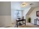 Well-lit office space with a desk, chair, and natural lighting from a window at 5886 Urban St, Arvada, CO 80004