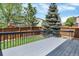 Inviting backyard deck perfect for outdoor gatherings and enjoying the green backyard at 9885 Thornbury Way, Highlands Ranch, CO 80129
