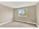 Neutral bedroom with carpet, and a window offering natural light and pleasant outdoor views at 9885 Thornbury Way, Highlands Ranch, CO 80129