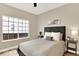 Comfortable bedroom with a large window, neutral tones, and stylish furnishings creating a relaxing retreat at 9885 Thornbury Way, Highlands Ranch, CO 80129