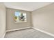 Neutral bedroom with carpet, and a window offering natural light and pleasant outdoor views at 9885 Thornbury Way, Highlands Ranch, CO 80129