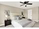 Inviting bedroom with soft bedding, neutral colors, and elegant decor for a peaceful night's sleep at 9885 Thornbury Way, Highlands Ranch, CO 80129