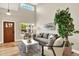 Bright living room with tall ceilings, neutral colors, and modern furnishings for a comfortable space at 9885 Thornbury Way, Highlands Ranch, CO 80129