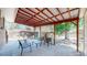 Covered back patio with seating at 8438 Ames St, Arvada, CO 80003