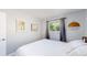 Cozy bedroom features a bed and views through the window at 8438 Ames St, Arvada, CO 80003